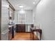 Gourmet kitchen with stainless steel appliances, dark wood cabinetry, and a subway tile backsplash at 475 28Th N Ave, St Petersburg, FL 33704