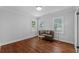 Bright living room featuring hardwood floors and ample natural light from multiple windows at 475 28Th N Ave, St Petersburg, FL 33704
