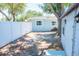 Backyard view showing the fence, shed, and outdoor space at 489 Fox Run Trl, Apollo Beach, FL 33572