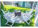 Backyard with white Adirondack chairs surrounding a fire pit, creating a cozy atmosphere at 489 Fox Run Trl, Apollo Beach, FL 33572