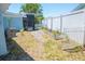 Backyard view featuring a garden and screened-in porch at 489 Fox Run Trl, Apollo Beach, FL 33572