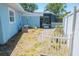 Backyard with a garden bed, and screened-in patio, perfect for outdoor living at 489 Fox Run Trl, Apollo Beach, FL 33572