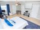A spacious bedroom is set up for a movie theater with a dog kennel, desk, and ceiling fan at 489 Fox Run Trl, Apollo Beach, FL 33572