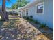 Landscaped garden featuring decorative lighting, enhancing the home's curb appeal at 489 Fox Run Trl, Apollo Beach, FL 33572