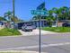 Street view of house with palm trees, a car and a truck parked in front of the home at 489 Fox Run Trl, Apollo Beach, FL 33572