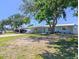 Charming single-story home with a covered carport, boat, and inviting curb appeal at 489 Fox Run Trl, Apollo Beach, FL 33572