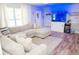 Inviting living room featuring a comfortable sectional sofa and custom fish tank display at 489 Fox Run Trl, Apollo Beach, FL 33572
