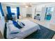 Spacious bedroom with a neutral palette, office space, and en-suite bathroom at 489 Fox Run Trl, Apollo Beach, FL 33572