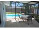 Screened-in pool area featuring a pool, seating, and view to backyard at 489 Fox Run Trl, Apollo Beach, FL 33572