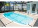 Bright, screened-in pool area featuring a pool, seating, and view to backyard at 489 Fox Run Trl, Apollo Beach, FL 33572