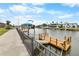 Private boat dock with lift offers immediate access to the bay, ideal for boating and fishing at 4976 Cedarbrook Ln, Hernando Beach, FL 34607