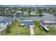 Beautiful single-Gathering home with lush green lawn, boat dock, and canal access to open bay at 4976 Cedarbrook Ln, Hernando Beach, FL 34607