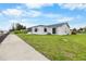 Charming waterfront home with lush landscaping and private dock at 4976 Cedarbrook Ln, Hernando Beach, FL 34607