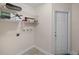 Laundry room with washer hookups and storage shelves at 4976 Cedarbrook Ln, Hernando Beach, FL 34607