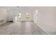 Bright, open living space with tile flooring and view of the front yard, offers space for decor at 4976 Cedarbrook Ln, Hernando Beach, FL 34607
