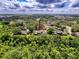 A high angle aerial view of a townhouse community, with an arrow pointing to the listing location at 507 E Curlew Pl, Tarpon Springs, FL 34689