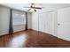 A cozy bedroom with a large window and closet space for ample storage at 507 E Curlew Pl, Tarpon Springs, FL 34689