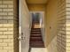 A welcoming entryway with beautiful wood stairs leading to the upper level at 507 E Curlew Pl, Tarpon Springs, FL 34689