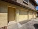 Three-car garage with painted doors and brick exterior at 507 E Curlew Pl, Tarpon Springs, FL 34689