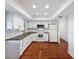 Bright kitchen with white cabinetry, modern appliances, and sleek countertops at 507 E Curlew Pl, Tarpon Springs, FL 34689