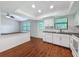 Open-concept living area with hardwood floors, recessed lighting, and a functional layout at 507 E Curlew Pl, Tarpon Springs, FL 34689