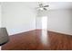 Open concept living room with wood floors and a vaulted ceiling at 507 E Curlew Pl, Tarpon Springs, FL 34689