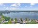 Expansive lake view from above the neighborhood showcasing the surrounding greenery and distant city skyline at 5109 Vinson Dr, Tampa, FL 33610