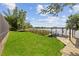 Spacious backyard with lush lawn, boat dock, and lake views at 5109 Vinson Dr, Tampa, FL 33610