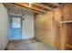 This basement view has a blue door and a plywood accent wall at 5109 Vinson Dr, Tampa, FL 33610