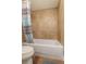 Cozy bathroom featuring a tiled shower/tub combination and a convenient toilet, perfect for relaxing at 5109 Vinson Dr, Tampa, FL 33610