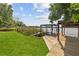 Picturesque boat dock and lift with lake views and lush green lawn at 5109 Vinson Dr, Tampa, FL 33610