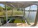 This is an additional view of the boat lift with canopy, showcasing waterfront access at 5109 Vinson Dr, Tampa, FL 33610