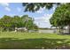 Community park featuring a playground, beach volleyball, and lake access at 5109 Vinson Dr, Tampa, FL 33610