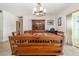Dining area featuring wooden furniture, chandelier, and a hutch for storing collectibles at 5109 Vinson Dr, Tampa, FL 33610
