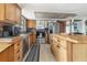 Well-lit kitchen with stainless steel appliances, a center island, and ample counter space at 5109 Vinson Dr, Tampa, FL 33610