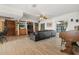 Spacious open-concept living room with built-ins, wood flooring, and abundant natural light at 5109 Vinson Dr, Tampa, FL 33610