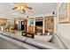 Comfortable living room with a view of the kitchen, stainless steel appliances, and tile flooring at 5109 Vinson Dr, Tampa, FL 33610