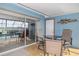 Enclosed patio features a table with seating and access to the screened-in pool at 5109 Vinson Dr, Tampa, FL 33610