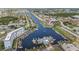 Aerial view of waterfront homes, boat docks and canals on a sunny day at 5157 Silent Loop # 208, New Port Richey, FL 34652