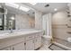 Bright bathroom featuring modern fixtures, a walk-in shower with a white shower curtain, and neutral tiling at 5157 Silent Loop # 208, New Port Richey, FL 34652