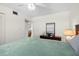 Bedroom with a ceiling fan and a view into the dining area at 5157 Silent Loop # 208, New Port Richey, FL 34652
