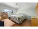 Comfortable bedroom with a ceiling fan and natural light, creating a peaceful sanctuary for rest and relaxation at 5157 Silent Loop # 208, New Port Richey, FL 34652