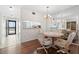 Well-lit dining area that has hardwood floors and a mirrored wall at 5157 Silent Loop # 208, New Port Richey, FL 34652