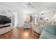 Comfortable living area with access to the dining area, featuring neutral paint at 5157 Silent Loop # 208, New Port Richey, FL 34652