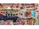 Overhead shot of a complex with a central courtyard, pool, and meticulously landscaped grounds at 521 Mandalay Ave # 307, Clearwater Beach, FL 33767