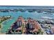 Expansive aerial view showcasing waterfront condominiums with boat docks and scenic harbor views at 521 Mandalay Ave # 307, Clearwater Beach, FL 33767
