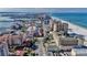 Stunning aerial view of a coastal city featuring pristine beaches and luxury condominium buildings at 521 Mandalay Ave # 307, Clearwater Beach, FL 33767