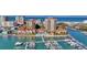 Stunning aerial view of beachfront condos, boat docks and azure waters at 521 Mandalay Ave # 307, Clearwater Beach, FL 33767