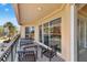 Cozy balcony seating overlooks the water and marina and has sliding glass doors at 521 Mandalay Ave # 307, Clearwater Beach, FL 33767