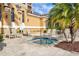 Hot tub with lounge chairs and mature landscaping at 521 Mandalay Ave # 307, Clearwater Beach, FL 33767